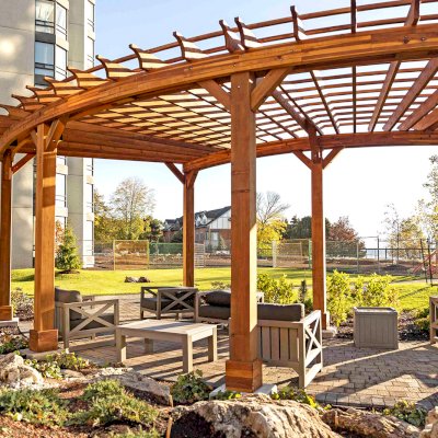 Fan Shaped Pergola Kit (Options: 38' x 14', California Redwood, With Roof Slats, 1 Electrical Wiring Trim Kit, 8-Post Anchor Kit for High-Wind, No Ceiling Fan Base, 10' Posts, No Curtain Rods, Transparent Premium Sealant). Photo Courtesy of A. Finnegan of Toronto, Ontario, Canada. 