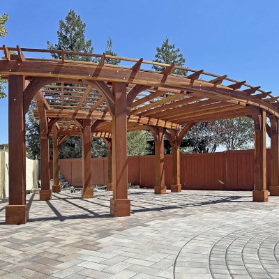 Fan Shaped Pergola Kit (Options: 35' x 16', California Redwood, With Roof Slats, No Electrical Wiring Trim Kit, Post Anchor Kit for High Wind, No Ceiling Fan Base, 10' Posts, No Curtain Rods, Transparent Premium Sealant). Photo Courtesy of R. & M. Gonzalez of Dublin, CA.