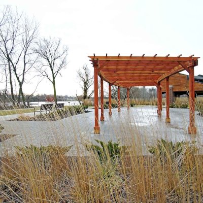 Fan Shaped Pergola Kit (Options: 50' x 14', California Redwood, Roof Slats at 18", No Electrical Wiring Trim Kit, 9-Post Anchor Kit for Concrete, No Ceiling Fan Base, 9.5' Posts, No Curtain Rods, Transparent Premium Sealant). Photo Courtesy of Metroparks Toledo of Toledo, OH.