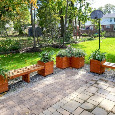 Forever Corner Planter (Options: 42" L x 20" W x 24" H, Douglas-fir, No Feet, No Trellis, Interior and Exterior of Box with Sealant (No Growing Vegetables), Transparent Premium Sealant). Photo Also Shows 2 Bench and Planter Combo. Photo Courtesy of S. Korapati of East Brunswick, New Jersey.
