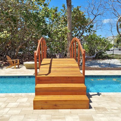 Custom Forever Foot Bridge (Options: 12' L, California Redwood, 5' Wide Instead of the Standard 4' Width, with Custom Steps, Transparent Premium Sealant). Photo Courtesy of A. Roe of Boca Grande, Florida.