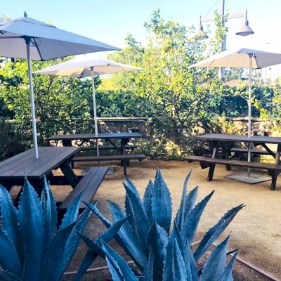 Forever Picnic Tables (Attached Benches) (Options: 6' L, 28 3/4" W, Side Benches, Douglas-fir, Standard Tabletop, Slightly Rounded Corners, 2" Umbrella Hole, Black Premium Stain). Photo Courtesy of D. Peters of Hawthorne, CA.