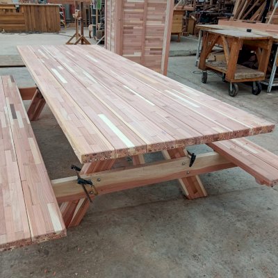 Forever Picnic Table Under Construction (Options: 10' L x 40 1/4" W, Mosaic Redwood, Standard Tabletop, Slightly Rounded Corners).