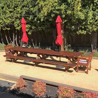 Forever Picnic Table (Attached Benches) (Options: 14' L x 34 1/2", Old-Growth Redwood, Standard Tabletop, Rounded Corners, 2" Umbrella Hole, Transparent Premium Sealant). Photo Courtesy of S. Chipman of Oakland, CA.