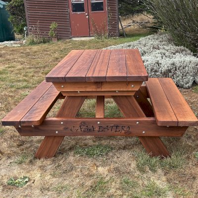 Forever Picnic Tables (Attached Benches) (Options: 4' L, 28 3/4" W, Attached Side Benches, Mature Redwood, Standard Tabletop, Rounded Corners, Custom Engraving, No Diamenter Umbrella Hole, Transparent Premium Sealant). Photo Courtesy of D. Tibbetts of Bodega Bay, CA.