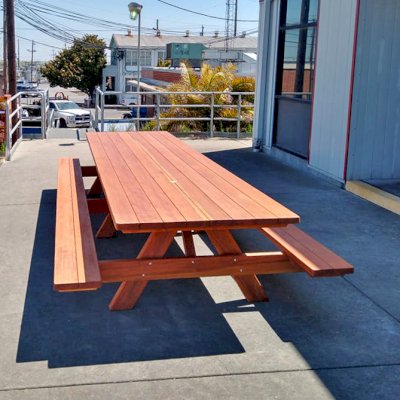 Custom Forever Picnic Tables (Attached Benches) (Options: 14' L x 48" W, California Redwood, Standard Tabletop, 2 Umbrella Holes, Slightly Rounded Corners, Transparent Premium Sealant). Photo Courtesy of E. Lagare of Martinez, CA. 
