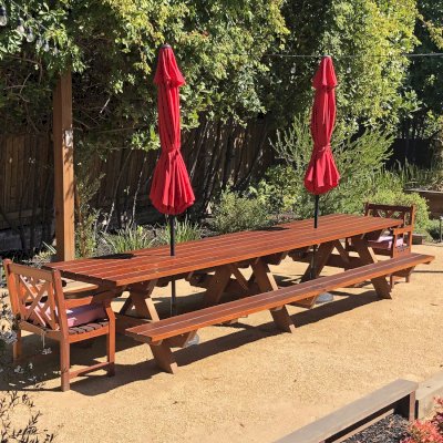 Forever Picnic Table (Attached Benches) (Options: 14' L x 34 1/2", Old-Growth Redwood, Standard Tabletop, Rounded Corners, 2" Umbrella Hole, Transparent Premium Sealant). Photo Courtesy of S. Chipman of Oakland, CA.