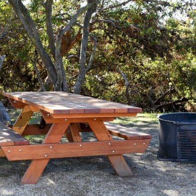 Forever Picnic Tables (Attached Benches) (Options: 8' L, 34 1/2" W, Side Benches, California Redwood, Standard Tabletop, Squared Corners, No Umbrella Hole, Transparent Premium Sealant, ADA Accessible). Located at El Capitan State Beach near Santa Barbara, CA part of a 90 table installation completed in 2015.