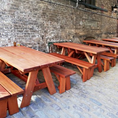 Custom Forever Picnic Tables (Unattached Benches) (Options: 5' L, 34 ½in W, Old-Growth Redwood, 1 Full Length Bench Per Side, Custom Tabletop (with the Book End Work to Make 2 Boards Look Like One 11 ½in Wide Board), Square Corners, 2in Umbrella Hole, Table with an Extra Brace Underneath to Hold the Umbrella Stand, Transparent Premium). Photo Courtesy of A. Koval of Chicago, Illinois.