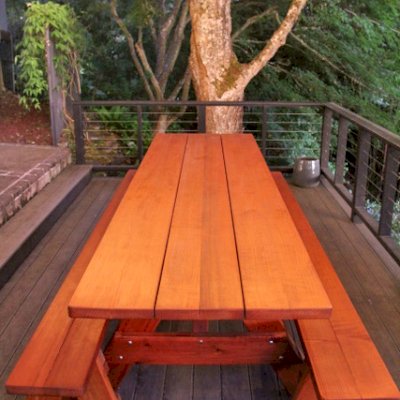 Custom Forever Picnic Tables (Unattached Benches) (Options: 10' L, 34 ½in W, Mature Redwood, 1 Full Length Bench Per Side, Standard Tabletop, Slightly Rounded Corners, No Umbrella Hole, Transparent Premium). Using Two Tongue & Groove Matching 5 3/4" Boards to Create the Appearance of an 11 1/2" Wide Board Construction. Photo courtesy of E. Johnson of Eugene, Oregon.