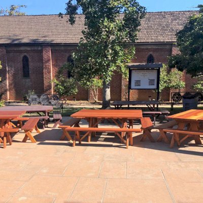 Custom Forever Picnic Tables (Unattached Benches) (Options: 6' L, 28 ¾in W, California Redwood, 1 Full Length Bench Per Side, Standard Tabletop, Slightly Rounded Corners, No Umbrella Hole, Transparent Premium). Tables Placed Together to Create a Square Table. Photo Courtesy of M. Sutton of San Marino, California.