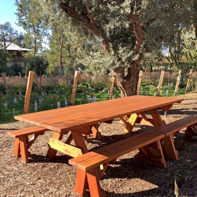 Forever Picnic Tables (Unattached Benches) (Options: 10' L, 46in W, Side Benches, Mature Redwood, 2 Half Length Benches Per Side, Standard Tabletop, Square Corners, 2in Umbrella Hole, Transparent Premium Sealant). Photo Courtesy of H. Williams of Sonoma, CA.