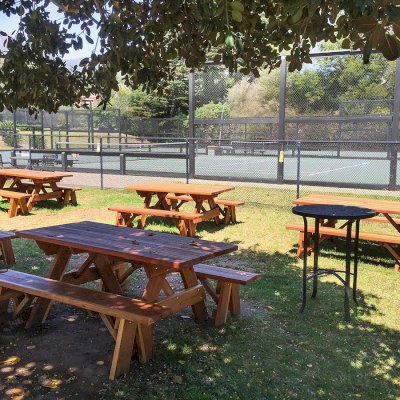 Forever Picnic Tables (Unattached Benches) (Options: 6' L, 34 ½in W, Side Benches, California Redwood, 1 Full Length Side Bench Per Side, Standard Tabletop, Squared Corners, No Umbrella Hole, Transparent Premium Sealant). Photo Courtesy of The Knowlwood Tennis Club of Santa Barbara, CA