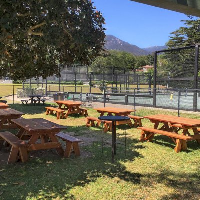 Forever Picnic Tables (Unattached Benches) (Options: 6' L, 34 ½in W, Side Benches, California Redwood, 1 Full Length Side Bench Per Side, Standard Tabletop, Squared Corners, No Umbrella Hole, Transparent Premium Sealant). Photo Courtesy of The Knowlwood Tennis Club of Santa Barbara, CA
