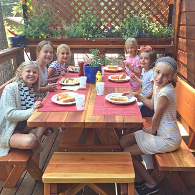 Forever Picnic Tables (Unattached Benches) (Options: 6' L, 34 ½in W, Fullback Side Benches & Backless End Benches, California Redwood, 1 Full Length Side Benches Per Side, Standard Tabletop, Slightly Rounded Corners, 1 5/8in Diameter Umbrella Hole, Transparent Premium Sealant, Leg Flair Reduced from 47" Width at Base to Width of Tabletop). Photo Courtesy of M. Lyons of Tahoma, CA.