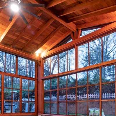 Forever Porch Pavilion (Options: 20' L x 20'-9" W, California Redwood, 2-Post Anchor Kit for High-Wind, No Electrical Wiring Trim, with 2 Fascia Boards for Gutters, 12 ft Posts Height, No Post Decorative Trims, 1 Ceiling Fan Base, No Curtain Rods, with Privacy Panels, Screened Sliding Doors and Fixed Screen Panels, Transparent Premium Sealant). Photo Courtesy of J. Pegg of Cordova, TN.
