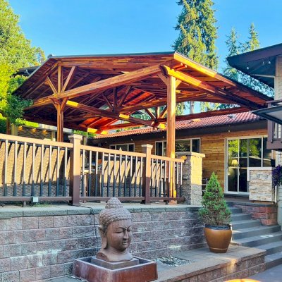 Forever Porch Pavilion (Options: 32'-4" L x 17'-10" W, Mosaic Redwood, 3-Post Anchor Kit for High-Wind, No Electrical Wiring Trim, 11ft Posts Height, No Ceiling Fan Base, No Curtain Rods, No Privacy Panels, Transparent Premium Sealant). Attached to Home Via Roof Risers. Photo Courtesy of S. Tomala of Federal Way, WA.