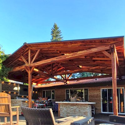 Forever Porch Pavilion (Options: 32'-4" L x 17'-10" W, Mosaic Redwood, 3-Post Anchor Kit for High-Wind, No Electrical Wiring Trim, 11ft Posts Height, No Ceiling Fan Base, No Curtain Rods, No Privacy Panels, Transparent Premium Sealant). Attached to Home Via Roof Risers. Photo Courtesy of S. Tomala of Federal Way, WA.
