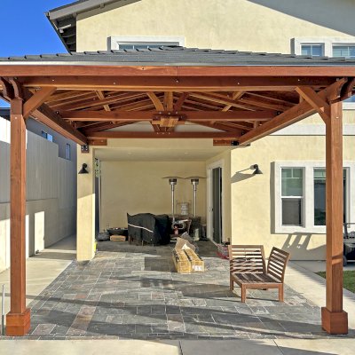 Custom Forever Porch Pavilion (Options: Hip Roof by Custom Request, 15' L x 15' W, California Redwood, 2-Post Anchor Kit for High-Wind, No Electrical Wiring Trim, 10.5ft Posts Height, 1 Ceiling Fan Base, No Curtain Rods, No Privacy Panels, Transparent Premium Sealant). Photo Courtesy of W. Zhang of Thousand Oaks, CA.