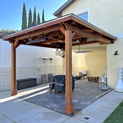 Custom Forever Porch Pavilion (Options: Hip Roof by Custom Request, 15' L x 15' W, California Redwood, 2-Post Anchor Kit for High-Wind, with 2 Electrical Wiring Trims, 10.5ft Posts Height, 1 Ceiling Fan Base, No Curtain Rods, No Privacy Panels, Transparent Premium Sealant). Photo Courtesy of W. Zhang of Thousand Oaks, CA.