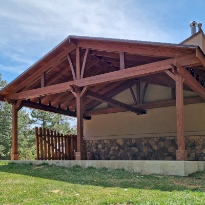 Forever Porch Pavilion (Options: 26' L x 15' W, California Redwood, 3-Post Anchor Kit for High-Wind, No Electrical Wiring Trim, 9 ft Posts Height, 2 Fascia Boards, No Post Decorative Trims, No Ceiling Fan Base, No Curtain Rods, No Privacy Panels, Coffee-Stain Premium Sealant). Photo Courtesy of R. Hoban of Evergreen, CO.