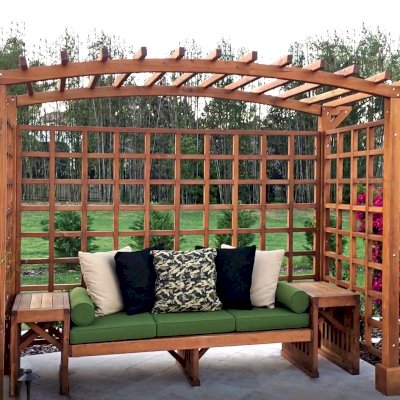 Custom Garden Arbor Bench (Options: 96" W x 5' D x 7'-1/4" H, Mature Redwood, Custom Bench with Side Tables, with Rear Side Trellis by Custom Request, 4-Post Anchor Kit, Transparent Premium Sealant). Photo Courtesy of S. Porcaro of Windermere, Florida.