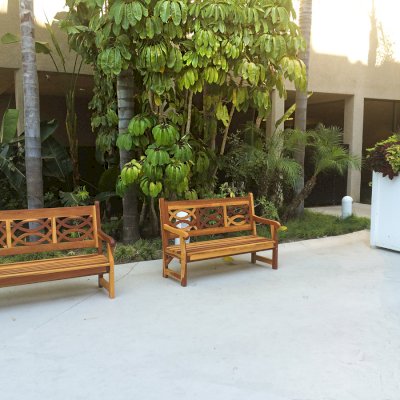 Hennell Wooden Garden Bench (Options: 5 ft, California Redwood, No Cushion, No Engraving, Transparent Premium Sealant). Photo Courtesy of Knott's Berry Farm in Buena Park, CA. You can see these benches in the courtyard of the Knott's hotel in Buena Park.