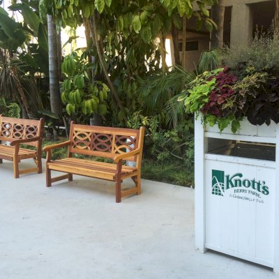 Hennell Wooden Garden Bench (Options: 5 ft, California Redwood, No Cushion, No Engraving, Transparent Premium Sealant). Photo Courtesy of Knott's Berry Farm in Buena Park, CA. You can see these benches in the courtyard of the Knott's hotel in Buena Park.