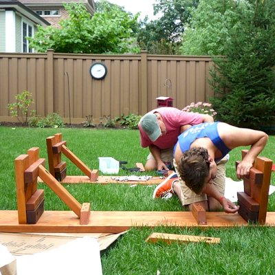 Assembly of a Heritage Large Wooden Picnic Table (Options: 12' L, 34 1/2" W, Side Benches, 2 Half Length Side Benches/Side, Classic Forever Benches, Standard Tabletop, Slightly Rounded Corners, Standard Leg Flair, No Umbrella Hole, Transparent Premium Sealant). Photo Courtesy of Pat Meyer of River Forest, Illinois.