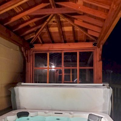 Hot Tub Enclosure Kits / Hot Tub Pavilion (Options: 14' x 7', California Redwood, Windows on 2 sides, 36" H Windows Clearance, 4-Post Kit for Concrete, Transparent Premium Sealant). Photo Courtesy of E. Dudek of Saint Paul, Minnesota.
