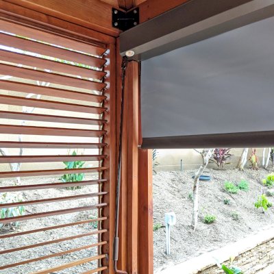 Hot Tub Enclosure Kits / Hot Tub Pavilion (Options: 12' x 16', Mature Redwood, Without Skylight, Custom Louvered Privacy Walls for the Top Half and Solid Wood Walls for the Bottom Half on 2 Sides, Transparent Premium Sealant). Photo Courtesy of J. Earney of San Diego, CA. Screen From North Solar Screen: https://northsolarscreen.com/outdoor-shades/blackout-total-privacy-shades/grande-blackout-heavy-duty/ 