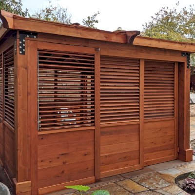 Hot Tub Enclosure Kits / Hot Tub Pavilion (Options: 12' x 16', Mature Redwood, Without Skylight, Custom Louvered Privacy Walls for the Top Half and Solid Wood Walls for the Bottom Half on 2 Sides, Transparent Premium Sealant). Photo Courtesy of J. Earney of San Diego, CA. Screen From North Solar Screen: https://northsolarscreen.com/outdoor-shades/blackout-total-privacy-shades/grande-blackout-heavy-duty/ 