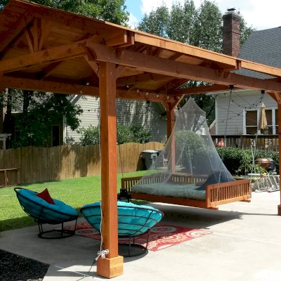 Jhoola Day Bed Swing Sets (Options: 7' L, 60" W, Seat Only, California Redwood, All Beam Hanging Hardware, Add 3 Railings (North, South and extra one, East or West), Day Bed Style, No Cushion, Transparent Premium Sealant). Also shows a Del Norte Pavilion.