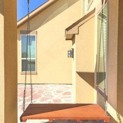 Jhoola Day Bed Swing Sets (Options: 5' L, 30" W, Seat Only, Old-Growth Redwood, All Beam Hanging Hardware, No Railings, No Railings, No Cushion, Transparent Premium Sealant). Photo Courtesy of Anita Singh of Katy, TX