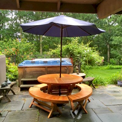 Karyn's Redwood Round Folding Picnic Tablee (Options: Douglas-fir, 3 Arc Folding Benches, Standard Tabletop, Checkerboard Design Tabletop, 1 5/8" Umbrella Hole, Transparent Premium Sealant). Photo Courtesy of A. McCauley of Guilford, Connecticut.