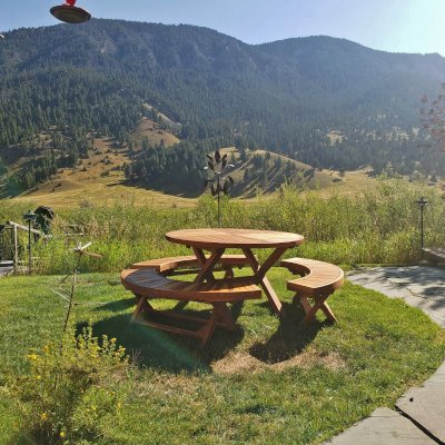 Karyn's Redwood Round Folding Picnic Table (Options: Arc Picnic Benches, California Redwood, 3 Arc Folding Benches, Standard Tabletop, Checkerboard, No Umbrella Hole, Transparent Premium Sealant). Photo Courtesy of B. Korth of Gallatin Gateway, MT.