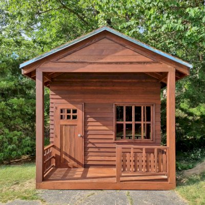 Kid's Backyard Cabin (Options: 14ft L x 10ft W, 8ft Wall H, Douglas-fir [Exterior Siding & Roofing in California Redwood by Custom Request], 4ft Front Porch Size [Included in the Overall Length], Interior Tongue & Groove Flooring, Shiplap Roof, Coffee-Stain Premium Sealant). Photo Courtesy of T. ONeill of Kimberling City, MO.