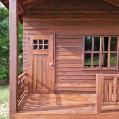 Kid's Backyard Cabin (Options: 14ft L x 10ft W, 8ft Wall H, Douglas-fir [Exterior Siding & Roofing in California Redwood by Custom Request], 4ft Front Porch Size [Included in the Overall Length], Interior Tongue & Groove Flooring, Shiplap Roof, Coffee-Stain Premium Sealant). Photo Courtesy of T. ONeill of Kimberling City, MO.