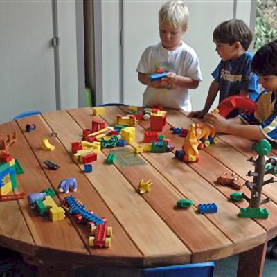 Kid's Round Outdoor Wood Table (Options: 5' Diameter, No Seating, California Redwood, Standard Tabletop, No Umbrella Hole, Transparent Premium Sealant). 