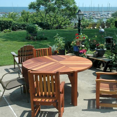 Lisa's Retro Outdoor Patio Table (Options: 5.5' Diameter, Chairs, California Redwood, with 3 Ruth Chairs, No Cushions, Standard Tabletop, No Lazy Susan, 1 5/8" Umbrella Hole, Transparent Premium Sealant). Photo Courtesy of Russell C. & Carmen A. of Milwaukee, Wisconsin.
