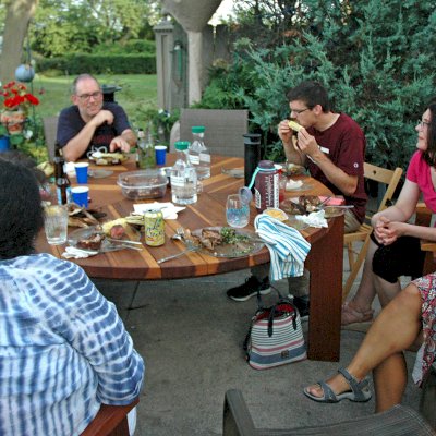 Lisa's Retro Outdoor Patio Table (Options: 5.5' Diameter, Chairs, California Redwood, with 3 Ruth Chairs, No Cushions, Standard Tabletop, No Lazy Susan, 1 5/8" Umbrella Hole, Transparent Premium Sealant). Photo Courtesy of Russell C. & Carmen A. of Milwaukee, Wisconsin.