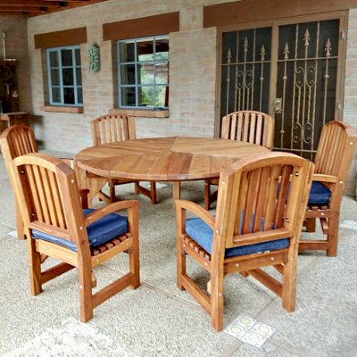 Lisa's Retro Outdoor Patio Table (Options: 5.5' Diameter, Chairs, Mature Redwood, with 6 Luna Armchairs, No Cushions, Standard Tabletop, No Lazy Susan, No Umbrella Hole, Transparent Premium Sealant). Photo Courtesy of T. Hoch of Tucson, Arizona.
