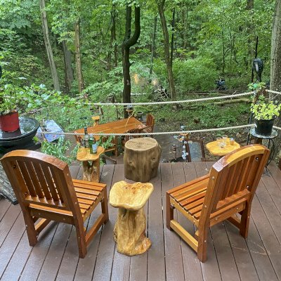 Luna Arch Back Wooden Chairs (Options: Without Arms, California Redwood, No Cushion, Transparent Premium Sealant). Photo Also Shows a San Francisco Patio Table Set in the Background. Photo Courtesy of M. Zamanzadeh of Presto, PA.