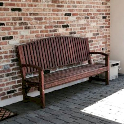 Luna Wood Bench (Options: 6 ft, Mature Redwood, No Cushion, Custom Engraving, Coffee-Stain Premium Sealant). Photo Courtesy of Teresa & Greg of Houston, Texas.