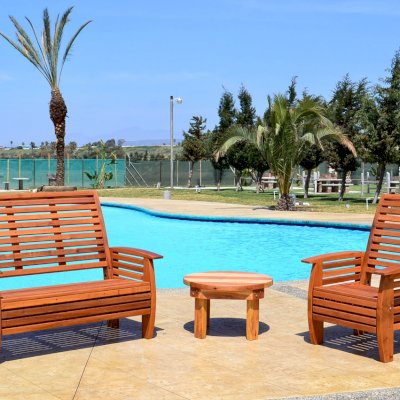 Marazul Wood Outdoor Loveseat (Options: Mature Redwood, No Cushion, Transparent Premium Sealant), Marazul Chair and Ashley Round Side Table.