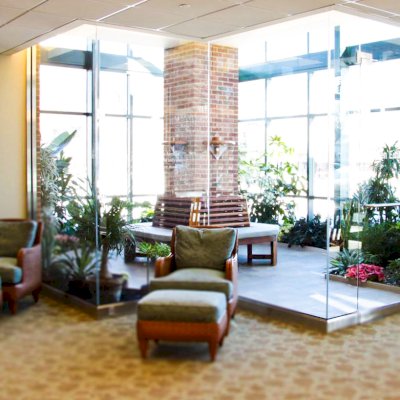 Maria's Tree Benches (Options: 6 1/2', California Redwood, No Beverage Ledge, Add Custom Cushion, No Engraving, Transparent Premium Sealant). Photo Courtesy of ECHN Hospital, Manchester CT 06040.  