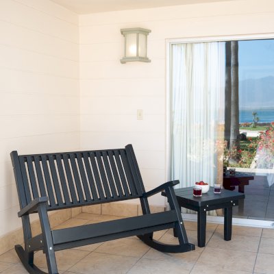 Massive Wooden Rocking Bench (Options: 4ft L, Deep, Douglas-fir, No Cushion, No Engraving, Black Stain Premium Sealant). Photo Also Shows a Square Side Table. Photo Courtesy of El Estero Beach Resort of Ensenada, Baja, Mexico. 