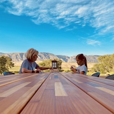 Maynard Modern Redwood Patio Table (Options: 10' L, 34 1/2" W Tabletop, No Seating, Mosaic Redwood, Standard Tabletop, No Umbrella Hole, Transparent Premium Sealant). Photo Courtesy of E. Mushlock of Shell, WY.