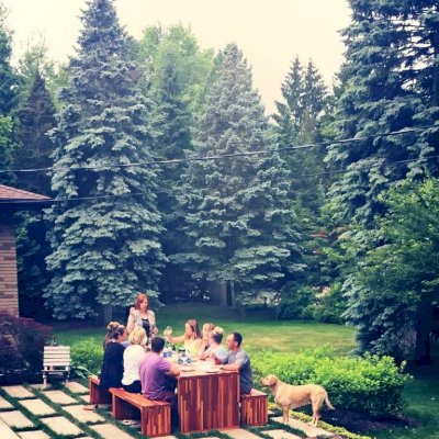 Maynard Modern Redwood Patio Table (Options: 8' L, 34 1/2" W Tabletop, Side Benches, Mosaic Redwood, 2 Half Length Maynard Benches Per Side, Standard Tabletop, 1 5/8" Diameter Umbrella Hole, Transparent Premium Sealant). Photo Courtesy of Sarah D'Agostino of Novi, Michigan.