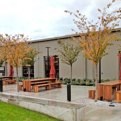 Maynard Modern Redwood Patio Tables (Options: 10' L, 34 1/2" W Tabletop, Side Benches, California Redwood, 2 Half Length Benches Per Side, Standard Tabletop, No Umbrella Hole, Transparent Premium Sealant). Photo Courtesy of Bill Judge of The Hewlett Packard Plant in Vancouver, WA.